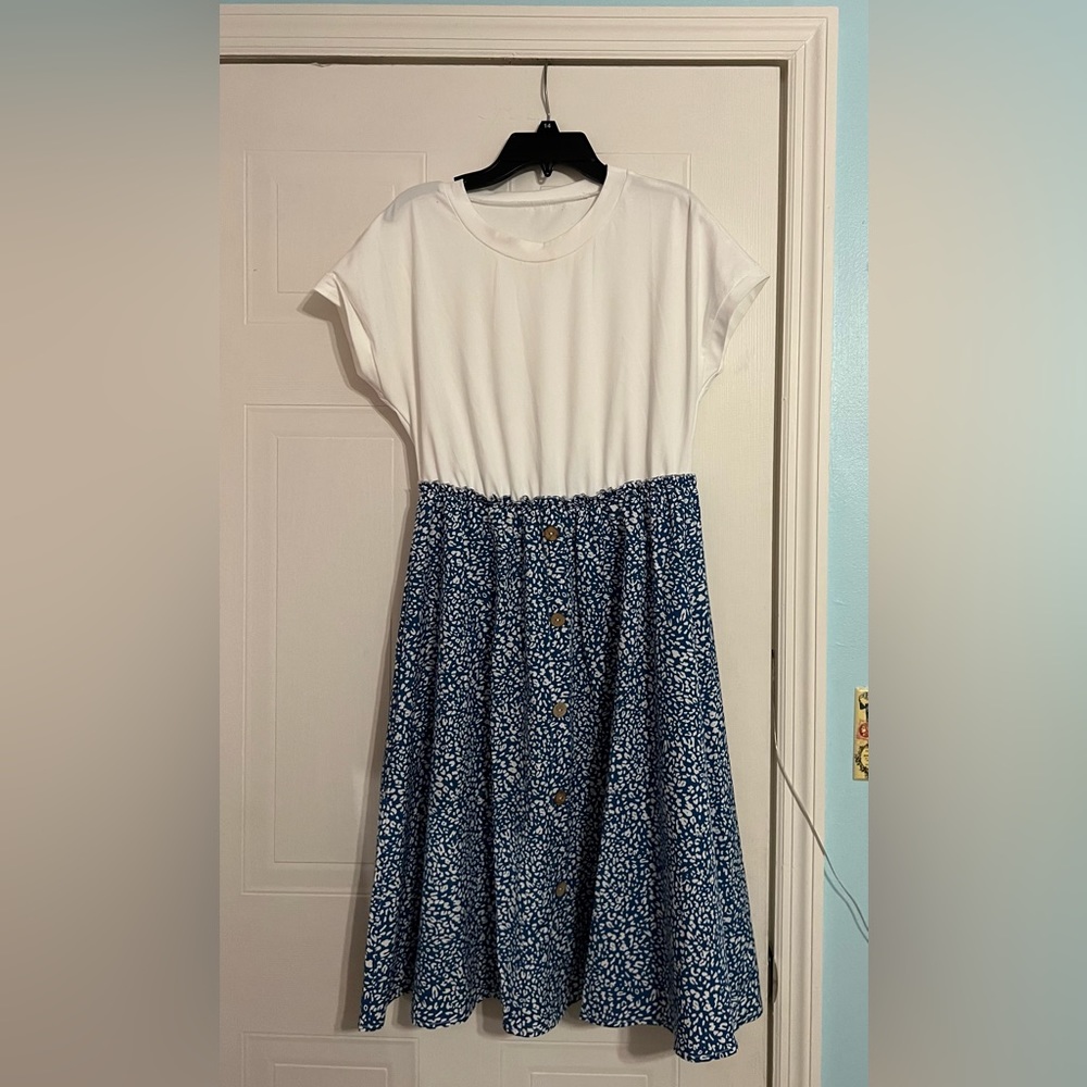 A cute, blue patterned, knee length, light summer dress